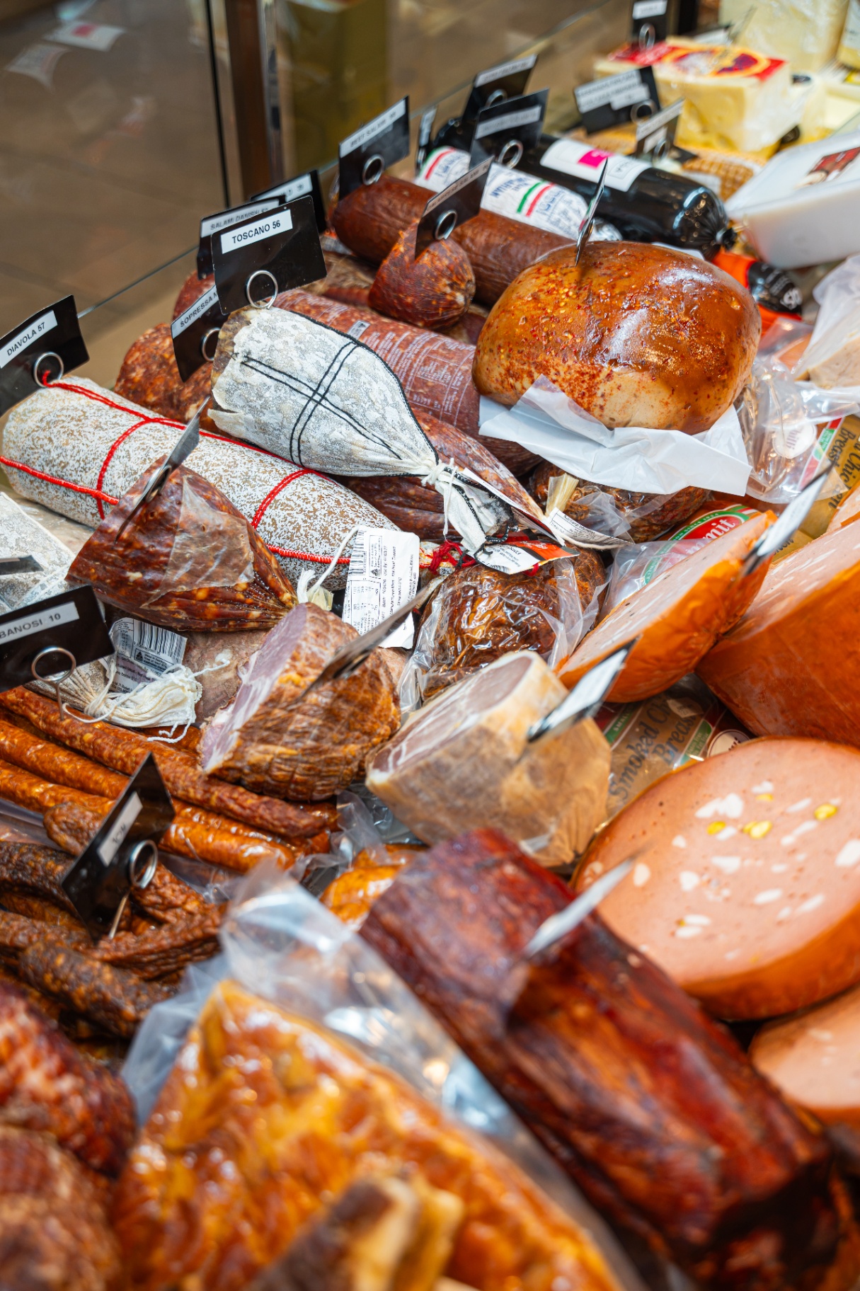 Stacked continental smallgoods and cured meats at the deli