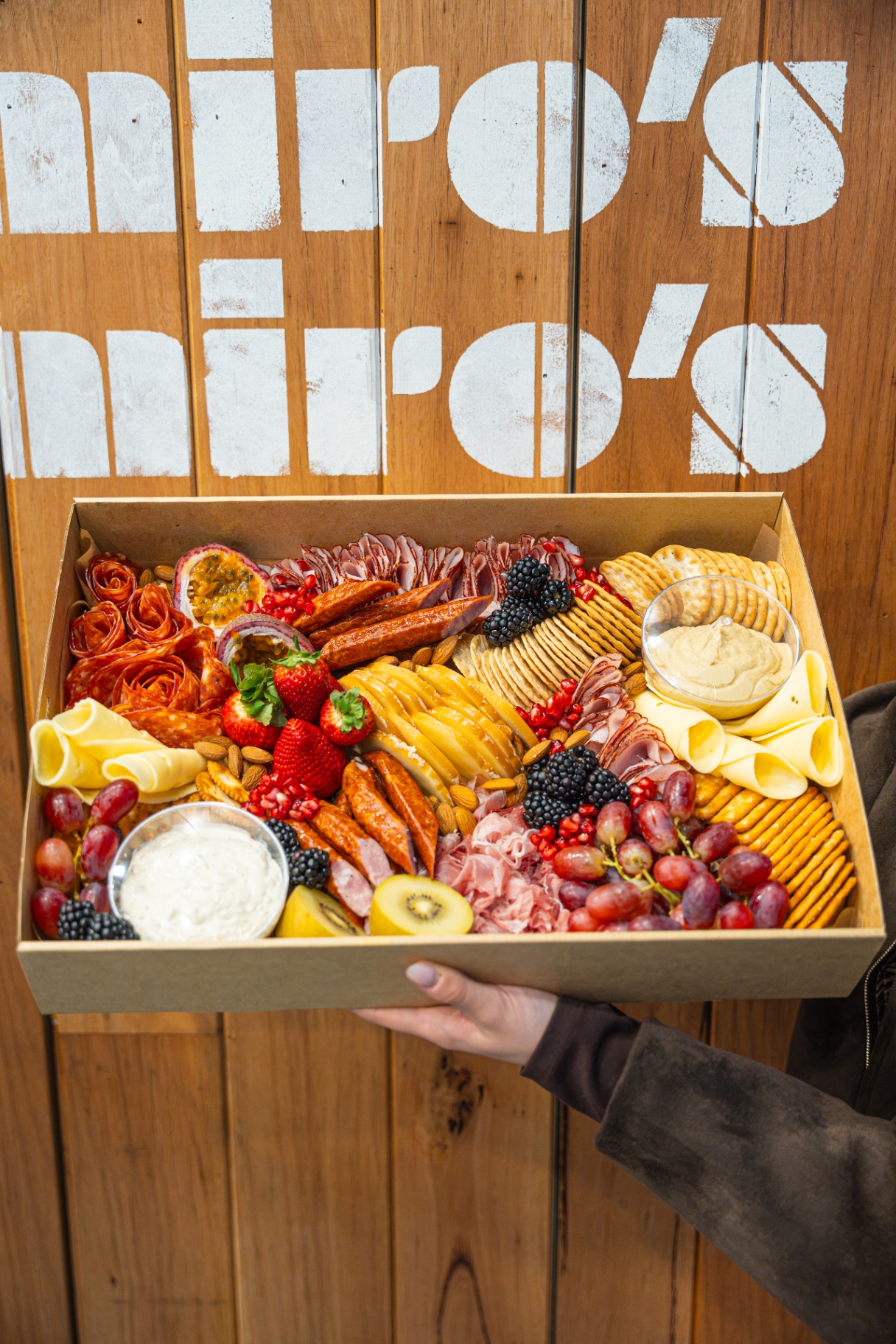 A Miro's Deli grazing box filled with cured meats, cheeses and antipasti.